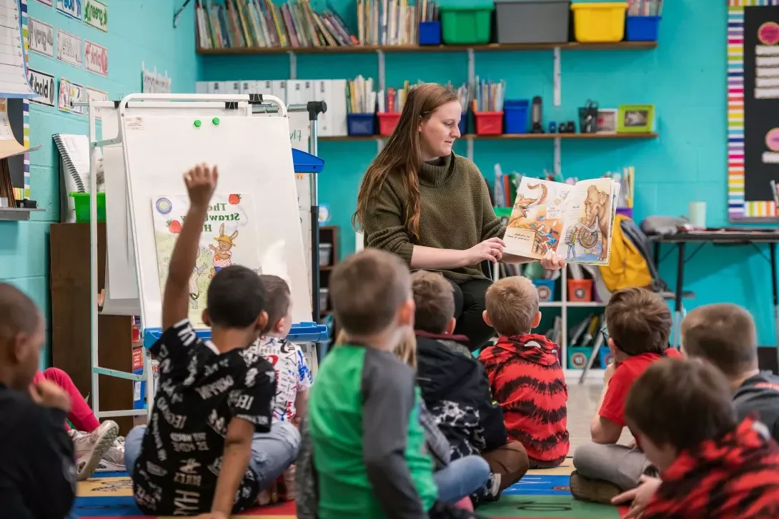 Teacher reading to students in elementary classroom